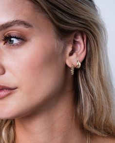 Beautifully handcrafted 14k solid yellow gold huggie earrings with a diamond row accent. Wear it by itself, or stacked with other Zoe Lev earrings. Sold as a pair Diamond Carat Weight: 0.18 ctw 24 diamonds Size: Approx. 7mm(W) x 12mm(H) Outer Diameter: Approx. 13mm Weight: Approx. 3.6g Standard Production: 5-8 Business Days Rush Order Production: 2-5 Business Days Shipping: Select shipping method at checkout. Shipped from our L.A. Studio. This item is Final Sale. See here for details. Gold Huggie Earrings, Diamond Carat, Huggie Earrings, Earring Sale, Diamond Sizes, Personalized Necklace, Huggies Earrings, Solid Yellow, Ring Bracelet