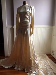 "Custom designed wedding gown from the late 1940's (1948-49) . Made for a woman who was approximately 115- 120 lbs and approximately 5'7\" tall. This gown could have be made by designer Caroline Herrera the workmanship and simple elegance screams her namesake. The icy pink satin is stunning in this gowns design, as is the pleated bustle back. Measurements are; Armpit to armpit Waist Feel free to convo me with any further questions. Thank you for your interest." Gold Full Length Wedding Gown, Gold Full-length Wedding Gown, Gold Full Length Gown For Wedding, Gold Full-length Gown For Wedding, Vintage Floor-length Gown For Debutante Ball, Vintage Fitted Wedding Dress For Debutante Ball, Vintage Ball Gown Wedding Dress For Formal Occasions, Vintage Floor-length Wedding Gown, Fitted Bodice Floor-length Gown For Vintage Events