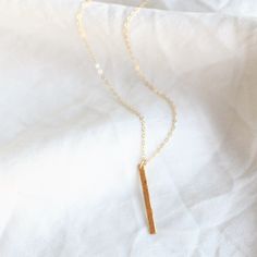 Bar Necklace - This simple necklace is available in sterling silver, rose gold filled or 14kt gold filled options. Our timeless vertical bar is a perfect everyday necklace. Great alone or layered this bar can be hammered or left smooth. -Petite vertical bar 26mm -Bar and chain are14kt gold filled or sterling silver -A high quality delicate link chain -Choose hammered or a light satin smooth finish Simple Bar Necklace With Delicate Chain, Minimalist Bar Necklace With Delicate Chain For Layering, Everyday Charm Necklace With Delicate Rectangular Pendant, Simple Everyday Bar Necklace With Delicate Chain, Minimalist 14k Gold Filled Charm Necklaces For Everyday, Everyday Rose Gold Necklace With Rectangular Pendant, Everyday Minimalist 14k Gold Filled Charm Necklaces, Dainty Sterling Silver Bar Necklace For Everyday, Dainty Everyday Necklace With Rectangular Pendant