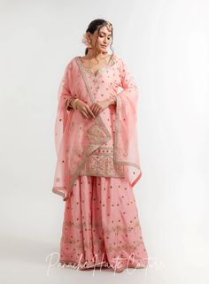 Peach Color Wedding Sharara Set Falak – Panache Haute Couture Peach Chanderi Sets With Sheer Dupatta, Pink Dola Silk Sharara For Eid, Pink Dola Silk Sharara With Dabka Work, Pink Raw Silk Sharara With Dabka Work, Diwali Pink Raw Silk Sharara, Anarkali Style Peach Palazzo Set With Resham Embroidery, Pink Raw Silk Palazzo Set With Chikankari Embroidery, Unstitched Peach Sets With Sheer Dupatta, Pink Chinon Sharara For Wedding