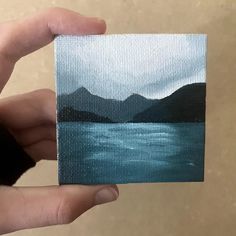 Photo of a mini canvas held between finger and thumb. Mini canvas is an oil painting of a lake and cliffs with turquoise blue water Lake Oil Painting, Water Paintings, Mini Oil Painting, Oil Painting Canvas, Mini Canvas Art, Water Painting, Mini Canvas, Beautiful Fantasy Art, Painting Canvas