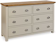 a white dresser with lots of drawers and knobs on the top drawer is shown