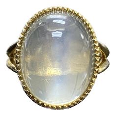 DeKara Designs Collection Art Deco Inspired Extremely Elegant Handmade Oval Cabochon Moonstone Engagement Ring. Metal- 18K Yellow Gold, .750. Stones- 1 Genuine Oval Cabochon Moonstone 19.67 Carats. Size- 8 3/4. FREE SIZING!!!! An Amazing One of a Kind Entirely Handmade Cabochon Huge Moonstone Engagement Created in 18K Yellow Gold. The ring features a beautiful high quality and clarity oval cabochon moonstone that is a whopping 19.67 carats! The moonstone is gracefully and professionally bezel set with perfection. The moonstone is surrounded by beautiful milgrain work which brings out the stone furthermore. The profile of the ring is truly amazing with flawless work that is finished with a high polish shine finish. This ring is one of a kind, and is entirely handmade. The moonstone is very Luxury White Oval Cabochon Moonstone Ring, Luxury Oval Cabochons For Wedding, Luxury Spiritual Oval Cabochon Rings, Luxury Domed Cabochon Moonstone Ring, Luxury Marquise Cabochon Jewelry, Luxury Oval Cabochon Elegant Jewelry, Luxury Rose Gold Oval Cabochon Jewelry, Moonstone Rings, Moonstone Engagement