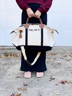 "This Weekender bag is perfect for a quick overnight trip or weekend getaway. The classic style boat tote in a variety of strap accent colors can be monogrammed or embroidered with your choice of phrases. Up to 10 characters per line, up to 3 lines of space. Choose a name, team, or my personal favorite- go with a funny phrase. So many font choices and monograms available, reach out if you don't see quite what you're after or need inspiration! 15\" H X 28\" W X 10\" D 3.45 lbs 18 oz Canvas Top zip closure with leather accent pullers Genuine leather handles Internal pocket with zipper closure Brass clips for removable shoulder strap Weekenders have a zipper closure & exterior pocket, as well as interior pockets that zip. They are sturdy and durable canvas that is made to last. with genuine l Rectangular Canvas Weekender Bag For Overnight Trips, Rectangular Canvas Bag For Overnight Trips, Rectangular Canvas Bag With Leather Handles For Overnight Trips, Cotton Bags With Luggage Sleeve For Overnight Trips, Large Capacity Tote Duffle Bag For Overnight Trips, Cotton Bag With Luggage Sleeve For Overnight Trips, Canvas Tote Bag For Overnight Trips, Casual Tote Travel Bag For Overnight Trips, Casual Tote Bag For Overnight Trips