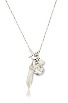 This glowing Selene Silver Charm Necklace is the perfect accessory for the goddess within! Sophisticated yet sweet, this lovely layered look features a pearl, quartz crystal, and hand-carved medallion that glimmer against a delicate figaro chain and silver toggle clasp. Summon your inner moon goddess and show off your stylish shine! 18" long sterling silver figaro chain and 12mm gold silver toggle clasp Freshwater pearl and quartz crystal are wire wrapped and pendant is hand carved Also availabl Luxury Sterling Silver Charm Pendant Necklace, Silver Charm Necklace, Necklace With Pearl, Charm Necklace Silver, Figaro Chain, Moon Goddess, Scarf Jewelry, The Goddess, Toggle Clasp