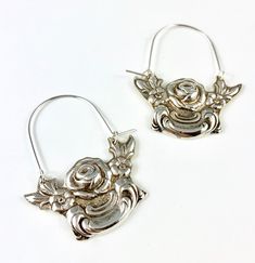 "These earrings are made from a vintage silver dish which had a beautiful embossed around the edge of flowers and other art nouveau motifs. I followed the line of the pattern into a point, drilled it and attached a sterling silver ear wire which is attached to either side of the charm. One side is hooked and unloops from the other side for you to insert the ear wire, and then clip it back up. They are very lightweight but are so eye catching. Measurements: Charm Length: 53 mm / 2.08\" Charm Widt Vintage Small Hoop Silver Jewelry, Vintage Silver Small Hoop Jewelry, Vintage Silver Engraved Earrings, Handmade Small Hoop Vintage Earrings, Handmade Vintage Small Hoop Earrings, Vintage Sterling Silver Pierced Hoop Earrings, Vintage Sterling Silver Hoop Earrings, Vintage Silver Metal Flower Earrings, Vintage Nickel-free Hoop Earrings