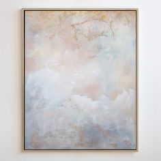 an abstract painting hangs on the wall in a white room with neutral and pale colors