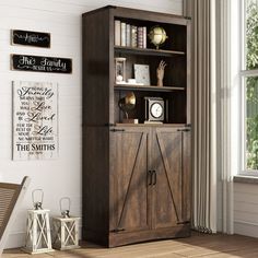 a wooden bookcase sitting next to a window