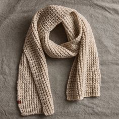 Cozy and warm, this knit scarf features a chunky waffle structure. The knit is made with three color twist yarns for a subtle marled effect. Bickley + Mitchell: The passionate, self-proclaimed knit obsessed at Bickley + Mitchell work to honor the craft that inspires them most. Based in Amsterdam, the company was founded in 2011 and has since strived to bridge the gap between fashion and function with its versatile hats, scarves, gloves, and socks. Bickley + Mitchell knitwear is driven by traditi Christmas Gifts For The Home, Color Twist, Chunky Scarves, Best Stocking Stuffers, Checked Scarf, Bandana Scarf, Blanket Scarf, Sweater Pattern, Gift Accessories