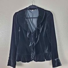 Brand: Saks Fifth Avenue Size 4 Beautiful silk blend velvet jacket with ruffle front and shawl collar. Hook & eye closure Excellent pre-owned condition Approximate Flat Measurements Shoulder to hem 22 Armpit to armpit 18 Waist 15 1435 Formal Long Sleeve Blazer With Ruffles, Formal Blazer With Ruffles, Long Sleeve Ruffled Outerwear For Formal Occasions, Formal Ruffled Long Sleeve Outerwear, Black Velvet Jacket, Evening Jacket, Evening Jackets, Velvet Jacket, Hook Eye