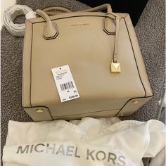 Beautiful Light Beige Color. Sturdy Leather. Comes With Dust Bag Shown. Luxury Beige Bags With Branded Hardware, Designer Beige Bags With Gold-tone Hardware, Designer Beige Bags With Branded Hardware, Designer Beige Box Bag With Gold-tone Hardware, Square Beige Bag With Branded Hardware, Beige Rectangular Satchel With Branded Hardware, Beige Square Bag With Branded Hardware, Modern Michael Kors Rectangular Satchel, Classic Rectangular Michael Kors Bag