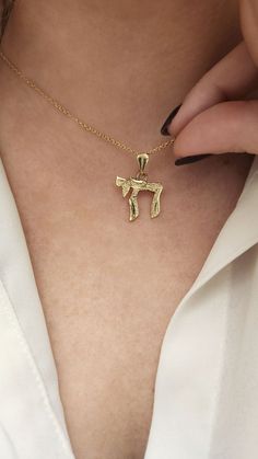 ★HEBREW CHAI GOLD NECKLACE★ My specially designed unisex CHAI gold pendant. 14K solid gold necklace. The "Chai" is a known Jewish and Hebrew word, symbol, amulet, and blessing.  The meaning it holds is 'life' and it is a symbol of good luck and a long good life. Chai Necklaces can be worn by people of all genders and ages. Mostly given as a Bar Mitzvah gift. Necklace Details: ★ Solid 14K gold, Choose your gold color yellow gold / white gold / rose gold ★ Choose the number of the style you want i Gold Amulet Necklace For Good Luck, Gold Charm Necklaces With Polished Finish For Gift, Gold Polished Finish Charm Necklace For Gift, Gold Polished Finish Charm Necklace As Gift, Gold Necklaces With Large Symbolic Pendant, Gold Charm Necklace As A Gift With Polished Finish, Gold Charm Necklace With Polished Finish In 14k Gold, 14k Gold Polished Charm Necklaces, Gold 14k Polished Finish Charm Necklace