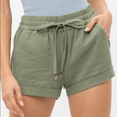 Light Olive Linen Blend Low Rise Wide Leg Smocked Pants Waist Tie Pocket Shorts 55% Linen, 45% Vicose Casual Khaki Solid Color Shorts, Spring Khaki Shorts With Elastic Waistband, Khaki Bottoms With Elastic Waistband For Summer, Summer Khaki Bottoms With Elastic Waistband, Casual Khaki Bottoms For Beach Season, Green Drawstring Bottoms For Spring, Khaki Drawstring Bottoms For Spring, Khaki Bottoms With Drawstring For Spring, Spring Khaki Drawstring Bottoms