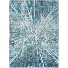 a blue and white rug with an abstract design