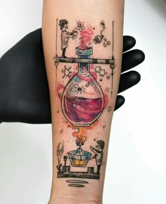 a person with a tattoo on their arm has a bottle filled with liquid and stars