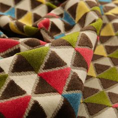 a close up view of a multicolored blanket