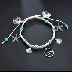 Enhance Your Beach Vibes With This Charming Ankle Jewelry. The Braided Chain Features Delicate Stainless Steel Charms Shaped Like Starfish And Shells, Bringing A Touch Of The Ocean To Your Style. The White And Turquoise Blue Color Combination Adds A Refreshing Pop Of Color To Any Outfit, Making It Perfect For Occasions Like Weddings, Anniversaries, Valentine's Day, Christmas, Or Simply For Everyday Wear. This Anklet Has A Slide-On Closure For Easy Wearing And Is Made Of Acrylic And Stainless Ste Starfish-shaped Beaded Beach Jewelry, Blue Anklet With Starfish Charm For Vacation, Blue Starfish Charm Anklet For Vacation, Ocean-inspired Strand Anklets As A Gift, Silver Bohemian Strand Anklets, Silver Strand Bracelets For Summer, Silver Bohemian Bracelets For Beach Season, Turquoise Anklets With Starfish Charm For Beach, Silver Adjustable Anklets For Vacation