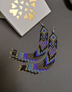 Long earrings made of gold and blue beads. Made from Czech beads. Length 7.2 inches (18cm) Width 0.8 inches (2 cm) Silver clasp Native Earrings, Seed Bead Jewelry Patterns, Earrings Drop, Earrings Long, Bead Jewelry, Seed Bead Earrings, Brick Stitch, Modern Earrings, Earrings Boho