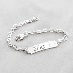 A quality children's ID bracelet made from 925 sterling silver. The filigree silver bracelet has an engravable plate and an enchanting heart pendant. You can have the bracelet engraved with a personal message, your desired name or a date on the front, back or both sides. You have a total of 18 characters including spaces on the front and 12 characters on the back (+6.00 EUR surcharge) at your disposal. Order the engraving on the back with the following link: https://www.etsy.com/de/listing/988579033/zusatzliche-engraving-back-side-for-one?ga_search_query=r%25C3%25BCckseite&ref=shop_items_search_5&frs=1&crt=1 The bracelet is closed with a classic carabiner. It is 14 cm long and has an additional eyelet at 12 cm. The eyelets are professionally soldered by us. All metal elements are made of 9 Silver Adjustable Nameplate Jewelry, Adjustable Silver Nameplate Jewelry, Dainty Silver Name Bracelet For Mother's Day, Personalized White Gold Name Bracelet As Gift, Personalized Dainty White Gold Name Bracelet, Personalized White Gold Dainty Name Bracelet, Dainty Customizable Silver Bracelet, Dainty Personalized White Gold Name Bracelet, Gift White Gold Nameplate Bracelet