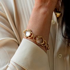 This versatile piece elevates the classic chain bracelet with an unexpected twist, artfully rendered with understated clear quartz beads and a subtly ornate gold motif for a dash of drama. Inspired by the effortless-yet-impeccable style that my fabulous French aunt achieves every day, who is able to take everything from a ballgown to a t-shirt, and make a moment of it. Pair with our Blandine Chain necklace to complete the look. Elegant Clear Bracelets As Gift, Elegant Clear Bracelet As Gift, Elegant Clear Bracelet Perfect For Gifts, Elegant Transparent Bracelet For Gift, Elegant Quartz Gemstone Jewelry, Elegant Gold-plated Chain Bracelet, Elegant Gold Faceted Chain Bracelet, Elegant Clear Jewelry With Chain, Elegant Clear Wedding Bracelets