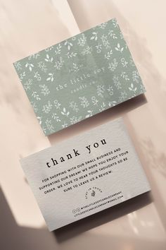 two business cards with the words thank you on them