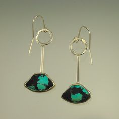 These turquoise drop earrings feature triangular cut stone of Chinese turquoise with dramatic markings set in sterling silver. A bold modern design with a mid century vibe. Modern Green Earrings With Polished Finish, Modern Long Drop Gemstone Jewelry, Modern Turquoise Jewelry With Polished Finish, Contemporary Pierced Teardrop Jewelry, Modern Turquoise Nickel-free Earrings, Modern Polished Turquoise Jewelry, Contemporary Jewelry With Teardrop Ear Wire, Contemporary Teardrop Ear Wire Jewelry, Contemporary Teardrop Jewelry With Ear Wire