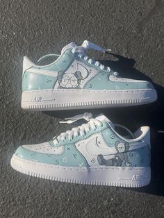 These custom Kaws-inspired Air Force 1 sneakers feature a stunning Prelude Gray and white color scheme with intricate hand-painted Kaws graphics. The iconic Companion character is showcased in detail, blending effortlessly with the swirling abstract designs and signature 'X' motifs across the shoes. Made with precision and creativity, these one-of-a-kind kicks offer a unique blend of street art and high fashion, perfect for sneakerheads and art lovers alike. Sneaker Painting, Bape Shoes, Air Force 1 Sneakers, Nike Fashion Shoes, Custom Air Force 1, Sneakers Athletic, Abstract Designs, Air Force Ones, Nike Fashion