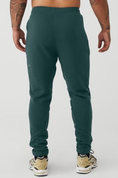 Layer it to and from the studio, practice in it or lounge in it: the Triumph Sweatpant is made of insanely comfortable triblend fleece. An easy-fitting drop crotch, wide gusset panel and drawcord waist are finished with fitted rib panels on the calves and inseam. For working out and wearing out Adjustable drawcord waistband Invisible zip pockets Alo Yoga Sports Bottoms With Elastic Waistband, Alo Yoga Full Length Loungewear Pants, Alo Yoga Full-length Loungewear Pants, Sporty Alo Yoga Bottoms With Comfort Waistband, Alo Yoga Cotton Athleisure Sweatpants, Alo Yoga Sportswear Sports Bottoms, Alo Yoga Sportswear Bottoms For Sports, Alo Yoga Sporty Bottoms With Comfort Waistband, Alo Yoga Sporty Activewear With Comfort Waistband