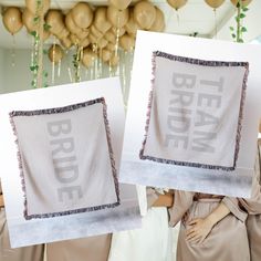 two women holding up pictures with the words bridal written on them and balloons in the background