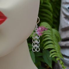 "These earrings look like woven hearts & they are made from 99% pure silver, also known as Fine Silver. Wear them to work with a suit, or jeans out shopping or let them shimmer and shine on the dance floor. They are flirty and fun. Average time for me to make these is 2-3 days. Each earring begins as a straight piece of wire. I then form round rings, fuse them shut with a torch and then bend and shape them. After that they are woven together. These earrings are each 4 links long and hang ove Handmade Silver Teardrop Heart Earrings, Jeans Sale, Shimmer And Shine, Heart Chain, Shimmer N Shine, Round Rings, Sterling Silver Heart, Chain Earrings, Pure Silver