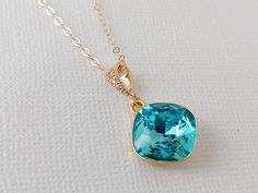 Light Turquoise Blue Turquoise Light Teal Colored Crystal Gold Cushion Cut Crystal Pendant Necklace with 14k Gold Filled Chain. PLEASE READ ITEM DESCRIPTION and SHOP POLICIES before placing your order, and contact me with any questions! CHAIN is 18 inches (45.7 cm) long, PENDANT is about 1 inch (2.5cm) long including bail. MATCHING EARRINGS: https://www.etsy.com/listing/511306168/light-turquoise-gold-earrings-teal?show_sold_out_detail=1&ref=nla_listing_details NECKLACES SECTION: https://www.etsy Blue Emerald Jewelry For May Birthstone, Blue May Birthstone Jewelry For Anniversary, Blue Emerald Jewelry For Formal Occasions, Turquoise Aquamarine Round Necklace, Elegant Blue Emerald Necklaces, Blue Pendant Jewelry For May Birthstone, Turquoise Aquamarine Necklace, Round Turquoise Aquamarine Necklace, Elegant Aquamarine Jewelry For May Birthstone