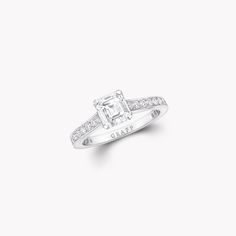 an engagement ring with a princess cut diamond set in the shan shan shan shan shan shan shan