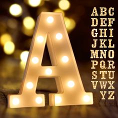 PRICES MAY VARY. Specification: Light up letters?size approx (W x H x D): 3.03" x 8.54" x 1.69" Made environmental ABS + PP material, requires no outlet, uses 2AA batteries(NOT included). Hanging holes and On/ Off switch on the back. Marquee letters with lights?can be displayed stand alone or hang on the wall. Easy to Use: Marquee letters with lights?(26 Alphabet letters and & symbols) provide endless possibilities of creating message. Spell out any name or phrase with these fabulous light up al White Led Letter Lights, Love Lights Wedding Letters, Wall Letter Lights, Metal Letter Lights, Initials Lights Wedding, Led Lights Name Sign, Led Writing Lights Bedroom, Light Up Letters Wedding Table, Lights For Signs