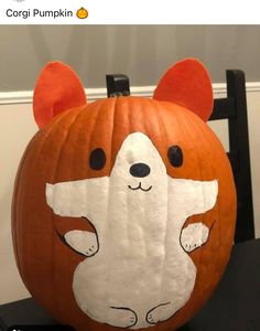 a carved pumpkin with an animal face on it