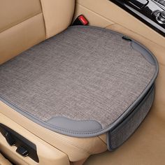 the interior of a car with a gray seat cushion