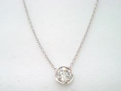 "HERE IS BEAUTIFUL DIAMOND BY THE YARD SOLITAIRE PENDANT NECKLACE 14 KARAT WHITE GOLD AVAILABLE YELLOW GOLD TOO ASK ME PLEASE...!! HANDMADE LOW BEZEL SET COMES WITH 16\" OR 18\" INCH CHAIN CENTER SHAPE- ROUND CUT- VERY GOOD CARAT- 0.35ct COLOR- G CLARITY- SI2 MEASUREMENT- 4.20mm TOTAL 0.35 CARAT BRIGHT WHITE COLOR AND CLEAN DIAMOND !! RETAIL PRICE IS OVER $2,900.00 COMES WITH $2,100.00 CERTIFIED APPRAISAL !! 100% FINE JEWELRY HAND-CRAFTED IN THE USA Why you should buy from Garo Celik Thank you f White Round Solitaire Necklace With Bezel Setting, White Pendant Jewelry With Bezel Setting, White Diamond Necklace With Bezel-set Round Cut, White Diamond Necklace With Round Cut Bezel Setting, White Diamond Necklace With Bezel Setting, Classic White Necklace With Bezel Setting, White Solitaire Necklace With Bezel Setting For Formal Occasions, Formal White Solitaire Necklace With Bezel Setting, White Solitaire Necklace With Bezel Setting For Wedding