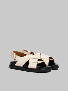 Iconic crisscross Fussbett sandal crafted from smooth calfskin leather, fastening with an adjustable buckle strap. Designed with leather insole and contrasting-colour rubber outsole. Raised Marni lettering on the heel. Trunk Bag, Slides Sandals, Boot Pumps, Pumps Flat, Slides Shoes, Cool Socks, Small Leather Goods, Belt Bag, Tote Handbags