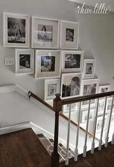 there is a staircase with pictures on the wall