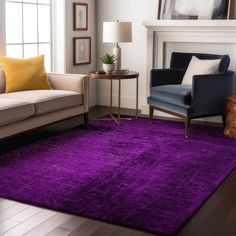 a living room with a purple rug on the floor