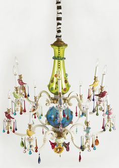 a multi - colored chandelier hanging from the ceiling