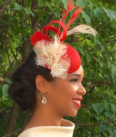 Red Fascinator with Peacock Feathers- Ivory trim on hat- Wedding Fascinator- Kentucky Derby-Royal As Luxury Red Fascinator, Red Structured Crown Costume Hat For Wedding, Red Structured Crown Hat For Weddings, Red Structured Crown Headpiece For Wedding, Red Feathered Fascinator, Red Headpiece With Structured Crown For Party, Red Pinched Crown Headpiece, Fitted Red Feathered Fascinator, Red Structured Crown Headpiece For Party