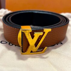 Authentic. In Good Condition. Only Defect Is The Scratch On The Lv. Leather On Actual Belt Is In New Condition. Only Wore Two Times. It’s Reversible With Brown And Black. Has Tag, Dust Bag, And Box. Possibly Still Have Lv Bag As Well. Still Have Receipts Lv Daily Multi Pocket Belt, Louise Vuitton Belt, Louis Vuitton Belt, Reversible Belt, Louis Vuitton Accessories, Louis Vuitton Shoulder Bag, Brown Leather Belt, Lv Bag, Leather Belt