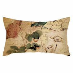 a decorative pillow with flowers and leaves on the front, along with an old - fashioned background