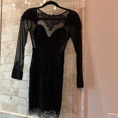 Black Lace And Sheer Mini Dress. Nwt. Label Says 8 But It Is 2/4 Sheer Lace Bodycon Dress For Parties, Sheer Lace Bodycon Dress For Night Out, Lace Mini Dress With Sheer Sleeves For Party, Sheer Sleeved Lace Mini Dress For Night Out, Lace Mini Dress With Sheer Sleeves For Night Out, Mini Lace Dress For Party, Black Mini Dress With Sheer Sleeves For Night Out, Black Lace Mini Dress For Night Out, Black Sheer Mini Dress For Cocktail