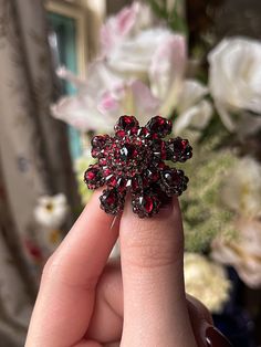 “The garnet is a red gem, but not like the ruby; its red is much more like that of a flame … It forms far in the east … If correctly cut and polished, it will reveal all its beauty and perfection.” – Aristotle, ca. 322 B.C. Hailing from the hills of what we now call the Czech Republic, these intricately cut garnet jewels from Bohemia were wildly popular in the 1890’s and throughout the Victorian era. Typically set in 6ct Garnet Gold, such as this example, bohemian garnet jewels came at a price most could afford. For the price of one large gold jewel, you could for example, buy 3 bohemian garnet pieces; this is perhaps why so many exquisite examples survive today, people were dripped out the Bohemian Garnet! This sizable floral brooch from the end of the 19th c is truly a knockout, and a be Luxury Red Brooches For Formal Occasions, Antique Red Brooch Jewelry, Antique Red Brooch, Antique Red Brooch For Formal Occasions, Antique Red Wedding Brooch, Luxury Red Brooch For Wedding, Historical Jewellery, Garnet And Gold, Floral Brooch