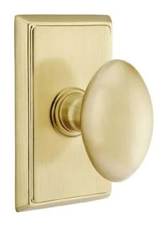 an antique brass door knob on a white background