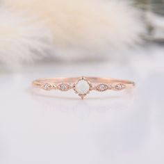 Unique tiny delicate victorian womens opal engagement ring, Small & dainty 14k rose gold vintage style art deco opal promise ring for her WE OFFER UNLIMITED PERIOD INSTALLMENTS PLAN This is a beautiful, stunning, feminine ring that works well for all occasions, styles, and ages. You will love it! Ring information: Main stone: White Opal Approximate size: 2.5mm (1 stone) Accent stones: White cubic zirconia Approximate size: 1.25mm (4 stones) Approximate width of Band 1.0mm Metal type: Gold Me Opal Ring Simple, Simple Unique Engagement Rings, White Opal Engagement Ring, Minimal Engagement Ring, Rose Quartz Ring Engagement, Opal Promise Ring, Small Engagement Rings, Cute Promise Rings, Vintage Opal Engagement Ring