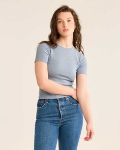 Made from soft, ribbed pima cotton with a touch of Spandex, this flattering tee works solo or layered under a sweater or shirt. Classic baby tee style, with a fitted silhouette and a shorter length. Features a crew neck with a slight scoop. 96% cotton/4% spandex. Imported. | WOMEN'S PIMA COTTON BABY TEE Ribbed Crew Neck T-shirt For Layering, Classic Fitted T-shirt For Fall, Solid Ribbed T-shirt For Layering, Cotton Ribbed Crew Neck Short Sleeve Top, Ribbed Cotton Crew Neck Short Sleeve Top, Ribbed Crew Neck Cotton Short Sleeve Top, Stretch Ribbed Solid Short Sleeve Top, Solid Color Ribbed Short Sleeve Stretch Top, Solid Ribbed Stretch Short Sleeve Top