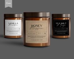 three jars of sea salt and honey on a grey background with the label in gold foil