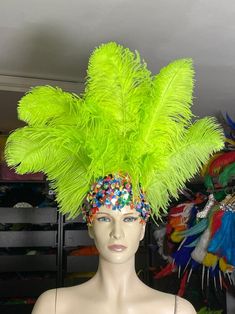 We make and ship our items really fast if you need it for a specific date please let us know.  Premium Ostrich feathers Headdress  Made in USA or call/text us at 954-3051817 to complete your order over the phone NEW STYLE  Collection Tiara Crown Clear Crystal   Headdress Carnival Headdress Mardi Gras  New Orleans Mardi Grass Parade Vegas Show Hora Loca If you are ordering 3 or more pieces from my store at one time, please send me a message and I will be able to give you combined shipping.  New Carnival   made with  Ostrich Floss feather wide  (feathers and crown) approximately* Secures firmly with a 1" glitter elastic band extremely light and easy to wear Ostrich Feathers are a natural product, each one is different and some variance, in color, length and texture should be expected. The fe Festival Ostrich Feather Trim Headpiece, Party Headpieces With Ostrich Feather Trim, Festival Headpiece With Ostrich Feather Trim, Ostrich Feather Trim Headpieces For Festivals, Costume Party Hats With Ostrich Feathers, Mardi Gras Costume Hat With Feathers, Feathered Costume Hats And Headpieces For Mardi Gras, Feathered Hats And Headpieces For Mardi Gras Costume Party, Carnival Party Headpiece With Feathers